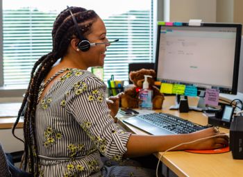 woman working in an office on a computer